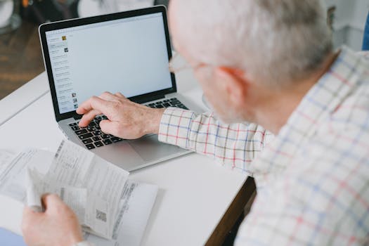 A person using a laptop to explore budgeting tools